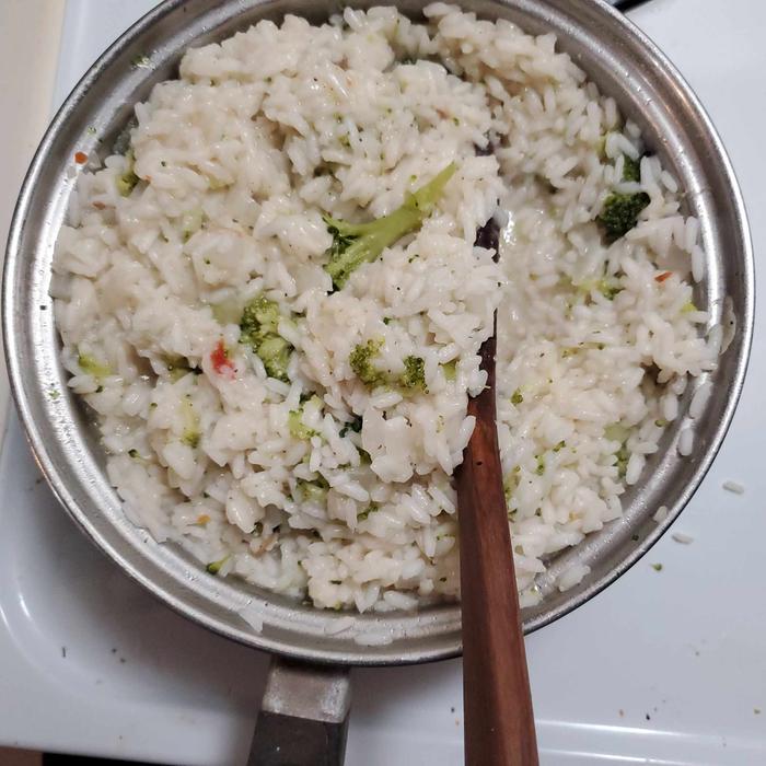 completed rice seasoned with salt and fresh ground black pepper