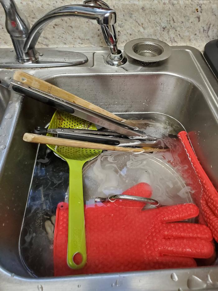 The dishes in two gallons of water and a couple squirts of soap.