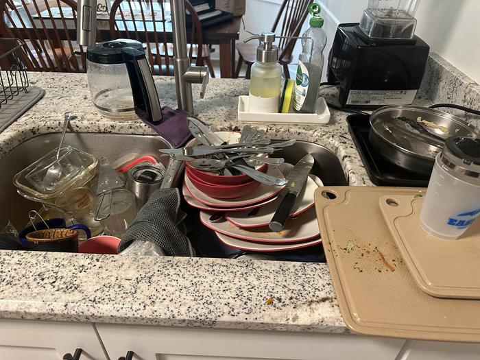 sink full of dirty dishes